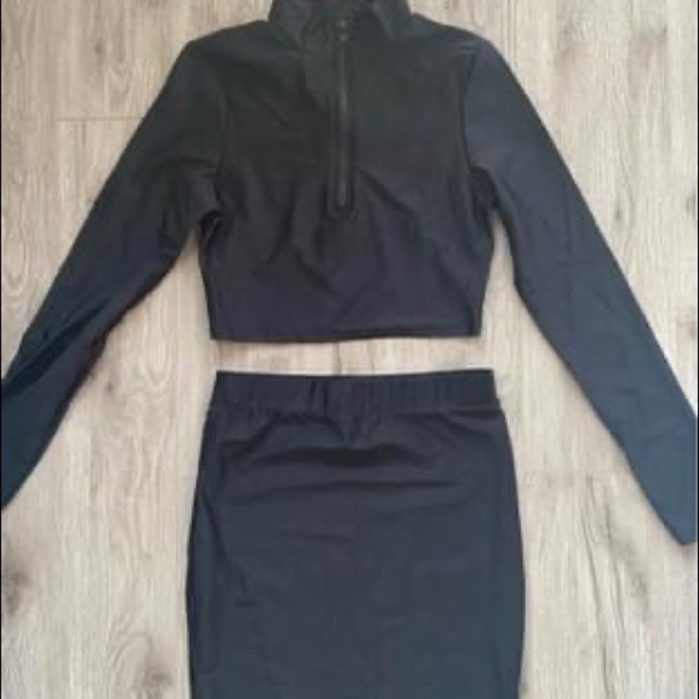 Black set of long sleeve top and skirt